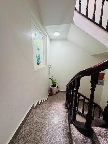 a stairway with a stair railing and a stair case at Sword Lake hostel in Hanoi