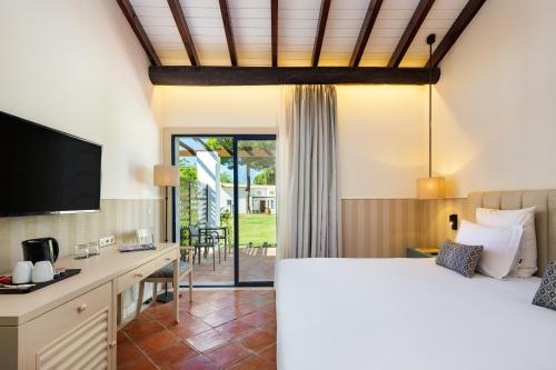 En eller flere senge i et værelse på Pestana Vila Sol - Vilamoura Premium Golf Resort