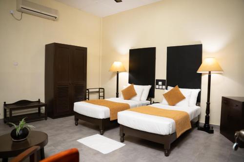 Postel nebo postele na pokoji v ubytování Heritage Dambulla By Ceylon Hotels Corporation