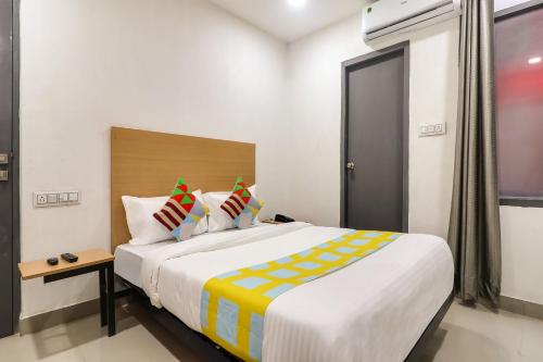 Katil atau katil-katil dalam bilik di Hotel O Basera Homes Jankipuram