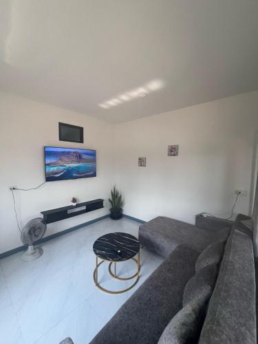 a living room with a couch and a table at Relax home in Ao Nang 