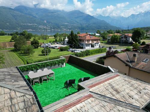 a view from the roof of a house with green grass at Dreamer House Deluxe - LakeView in Colico