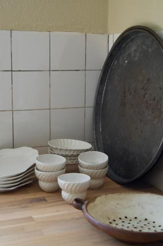 a group of bowls and plates sitting on a counter at SJ Apartment in Aarhus