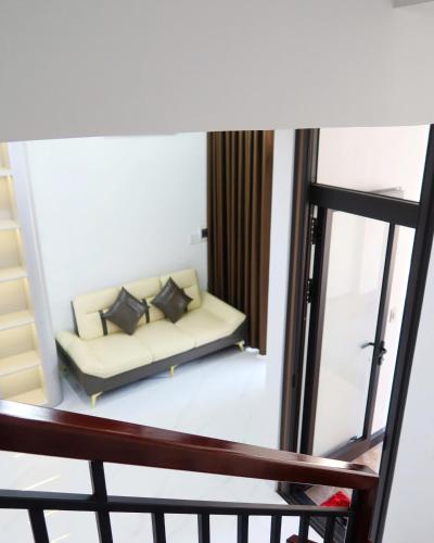 a view of a living room with a couch at Subin Homestay Hue in Thôn Kim Long (1)