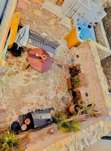 an overhead view of a patio with a table and a table at Villa Kastrouna, with private heated jacuzzi in Symi