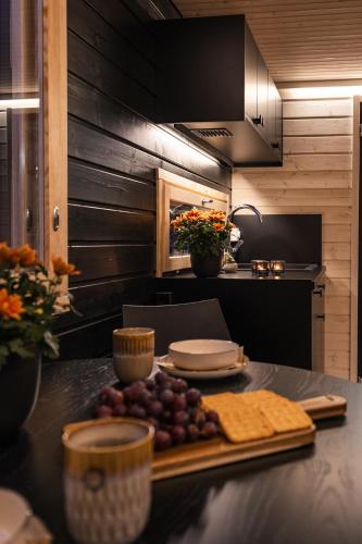 a kitchen with a table with food on it at Piilotupa in Inari