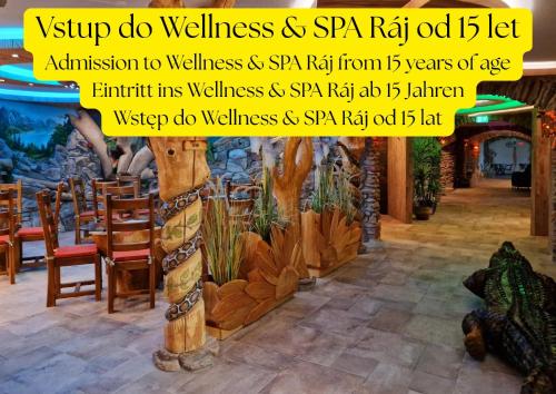 a picture of a restaurant with a sign that reads shop do wellness spa fab at Hotel Kocourkov in Hlinsko