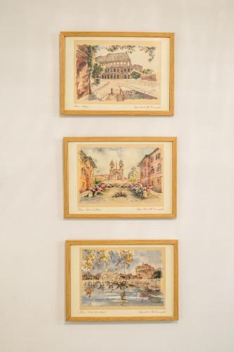 a group of four pictures hanging on a wall at Bendida Classic in Velingrad