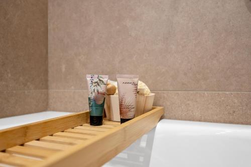 a wooden shelf with products on it in a bathroom at Frida in Vodice