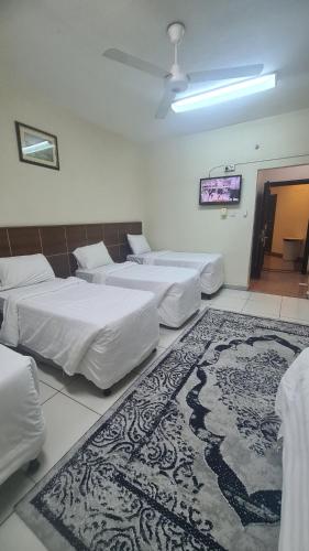 Postel nebo postele na pokoji v ubytování فندق أبراج الجنادرية