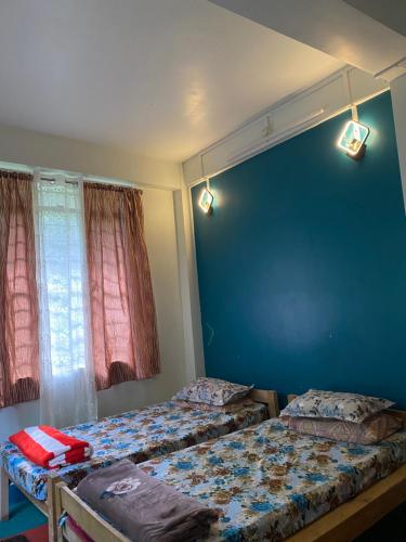 Cama o camas de una habitación en Pine Forest Home stay with Kitchen