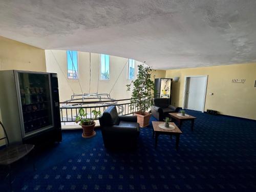 a living room with a couch and a table at Hotel Landhaus Milser in Duisburg