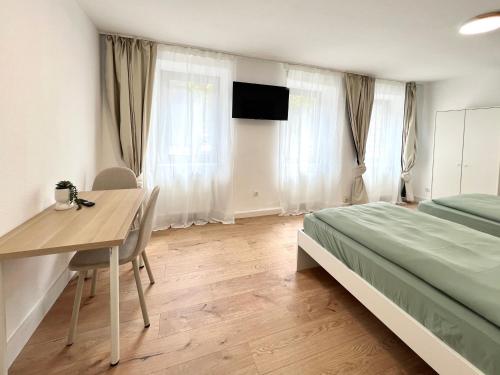 TV a/nebo společenská místnost v ubytování Privatzimmer in Apartment Brunnenstraße Braubach