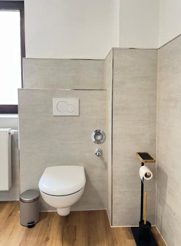 a bathroom with a white toilet in a room at Privatzimmer in Apartment Brunnenstraße Braubach in Braubach