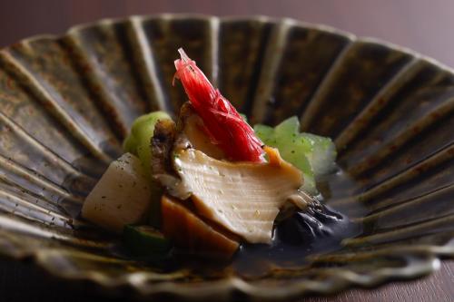 a plate of food with vegetables on it at Sun Urashima Yuki no Sato in Toba