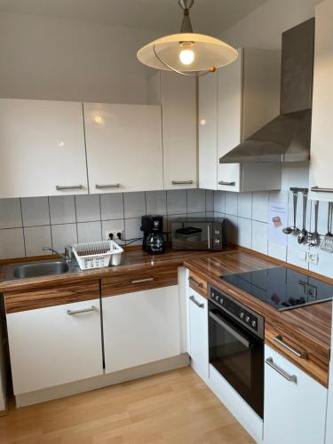 Η κουζίνα ή μικρή κουζίνα στο C&D Altstadtblick Monteurwohnung