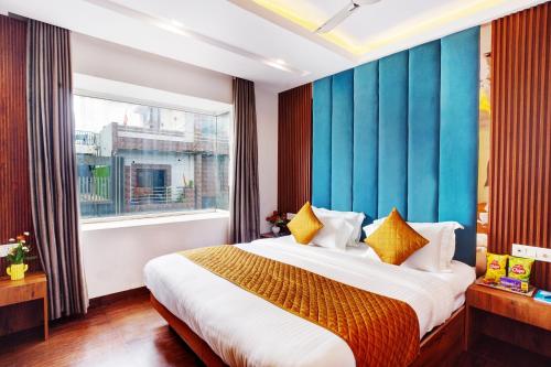 a hotel room with a bed and a window at Hotel Cabana 5 Mins Walking Distance From NDLS Station in New Delhi