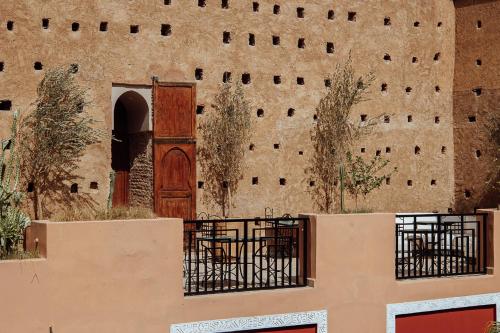 an old building with a door and a wall at Riad Kasbah privilège and SPA in Marrakech