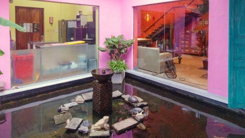 a room with a pond with a plant in it at Dickman Resort "The Boutique Hotel" in Negombo