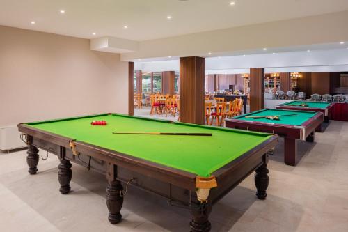 a billiard room with two pool tables in it at Silvanus Hotel in Visegrád