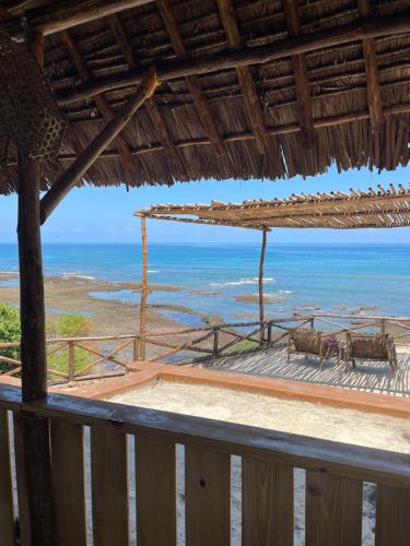 a view of the ocean from a resort balcony at Pangani Cliffs Lodge in Pangani
