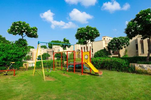 a park with a playground with a slide at Peaceful Escape in Gurgaon - Villa Retiro Do Sol in Manesar