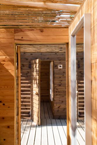 a wooden room with two doors in a building at DOMA Portugal in Mafra