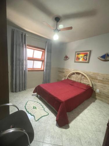 Ένα ή περισσότερα κρεβάτια σε δωμάτιο στο Recanto charmoso em Caraguatatuba