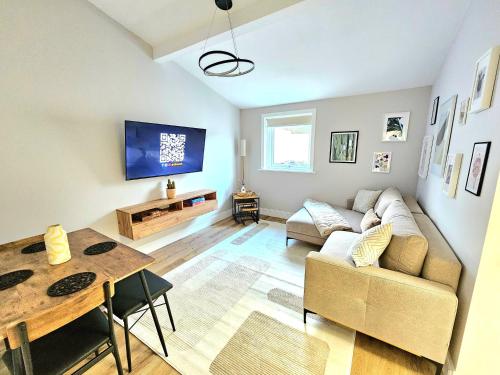 a living room with a couch and a table at Warm & Cosy Home in Glasgow in Glasgow
