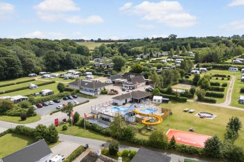 an aerial view of a park with a playground at First Camp Skovlund Camping & Cottages in Båring