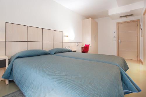 Postel nebo postele na pokoji v ubytování Hotel Miorelli