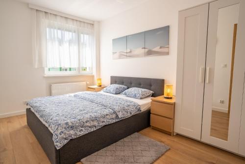 Ένα ή περισσότερα κρεβάτια σε δωμάτιο στο Apartament u Kasi