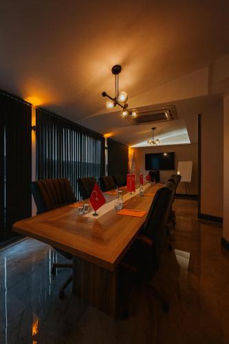 a conference room with a long wooden table and chairs at Rest By Dedeman Sapanca in Sapanca