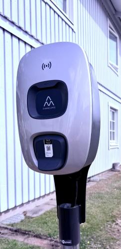 a parking meter sitting in front of a building at Easy Livin' Apartment Hotel in Växjö