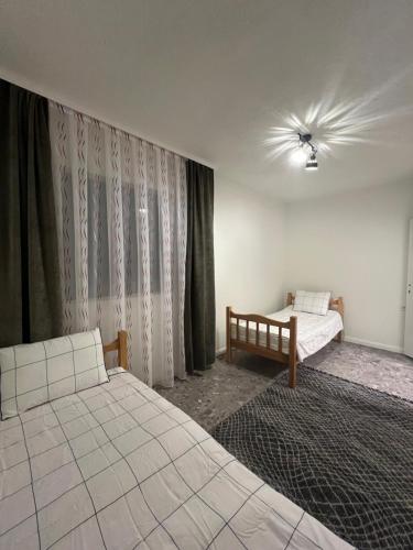 Ένα ή περισσότερα κρεβάτια σε δωμάτιο στο Large house for summer holidays