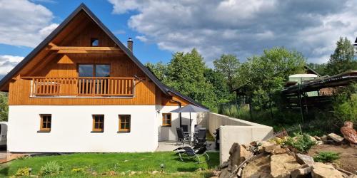 a house with a wooden roof at Chalupa Rubinka in Jeseník