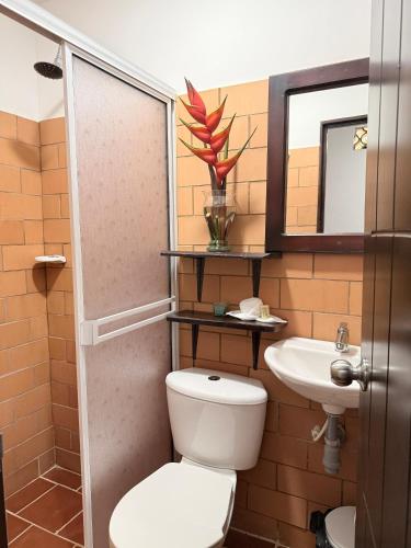 a bathroom with a toilet and a sink at Casa Blanca in Socorro