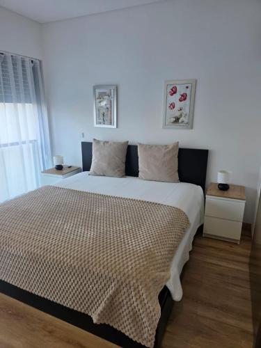 a bedroom with a large bed in a room at Cavalo Preto Luxury Beach Resort - C201 in Quarteira