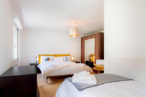 Ένα ή περισσότερα κρεβάτια σε δωμάτιο στο AnDerBlick Apartment