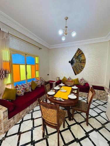 a living room with a table and a couch at Villa Privée avec Piscine et Calme Absolu 