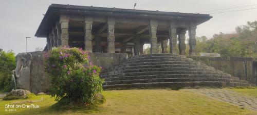a large building with steps in front of it at Skylark Homestay Panchalimedu in Pīrmed