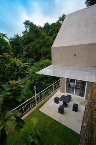 an overhead view of a building with a table and chairs at Tranquil Cabana - Kandy in Kandy