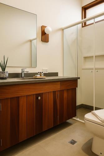 a bathroom with a sink and a toilet at 120 Hotel & Beach Club in Guarujá