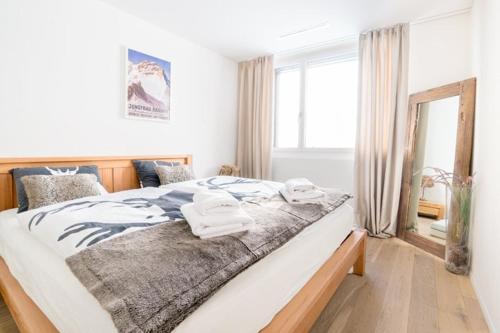 Katil atau katil-katil dalam bilik di Alpine Chic Apartment