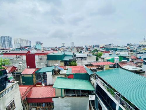 a group of roofs of buildings in a city at 25 House 298 Ngoc Lam - Long Bien bridge in Hanoi