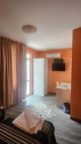Postel nebo postele na pokoji v ubytování Family Hotel Paros