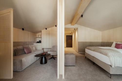 Una cama o camas en una habitación de Hotel COSMEA 4 Stars - Your Dolomites experience