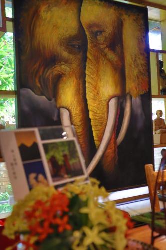 a painting of an elephant with tusks on a wall at Dai House in Xishuangbanna Village in Menghan