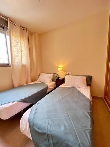 Postel nebo postele na pokoji v ubytování Denia Nature Apartment