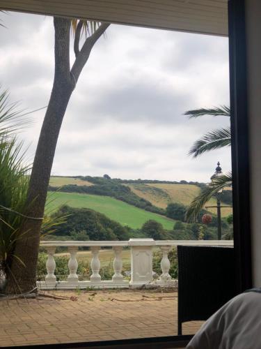 a view from the living room window of the golf course at Gannel View Apartment in Newquay